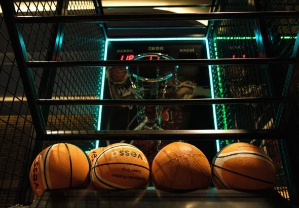 Close-up of basketballs at an arcade-style basketball hoop game
