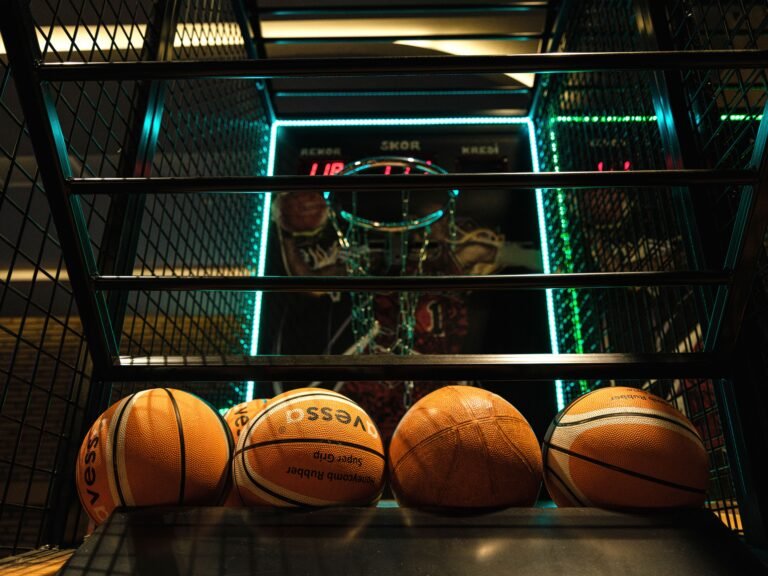 Close-up of basketballs at an arcade-style basketball hoop game