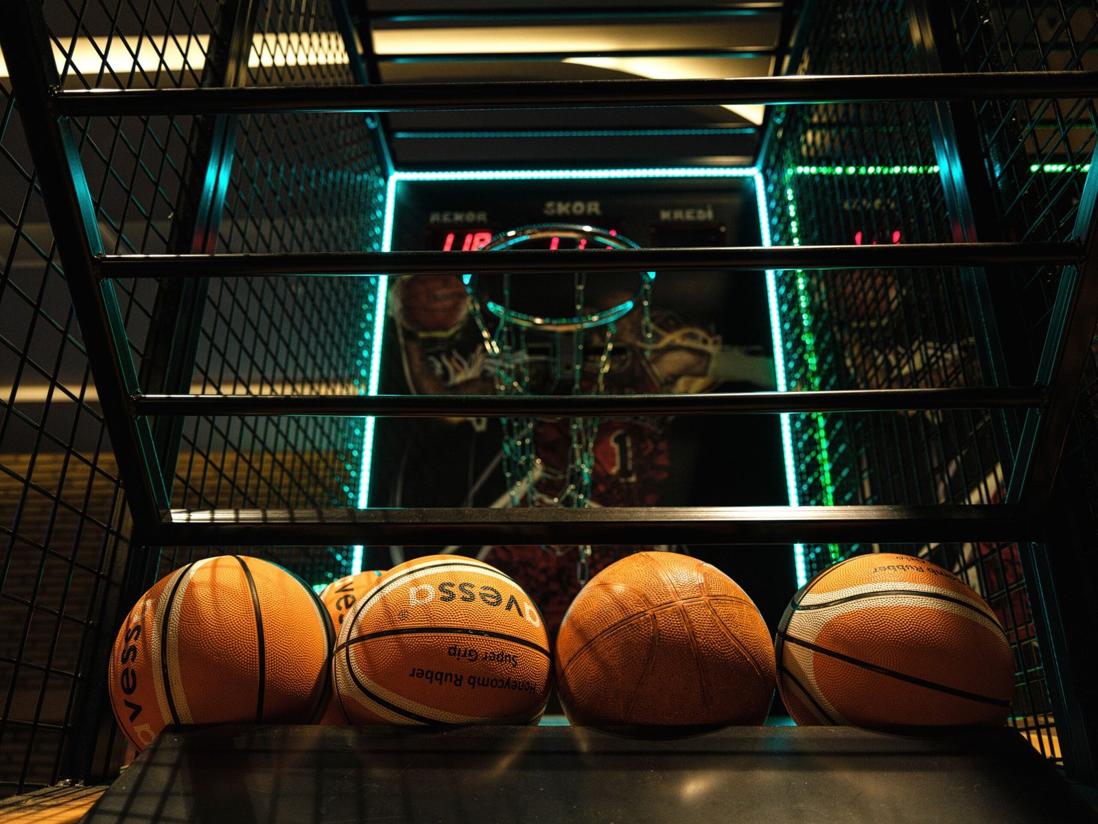 Close-up of basketballs at an arcade-style basketball hoop game