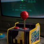 Compact retro gaming handheld with vertical form factor and D-pad