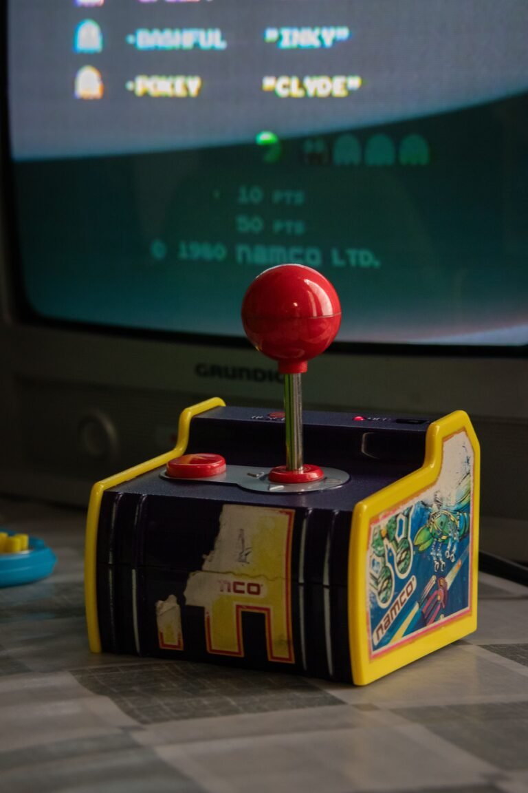Compact retro gaming handheld with vertical form factor and D-pad