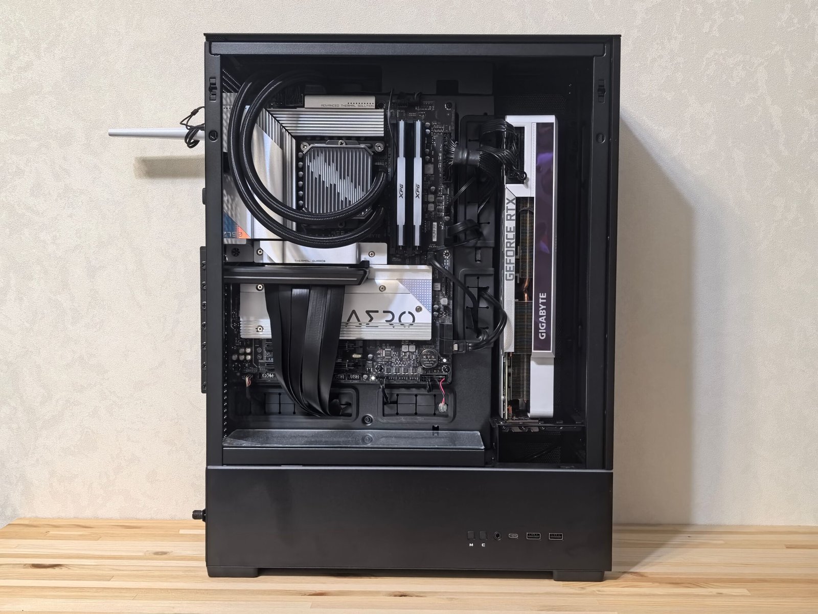 Custom-built gaming PC interior showing GPU and cooling system components
