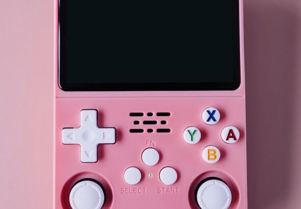 Handheld retro gaming device with directional pad and buttons