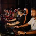 Group of young esports players competing seriously in a tournament setting