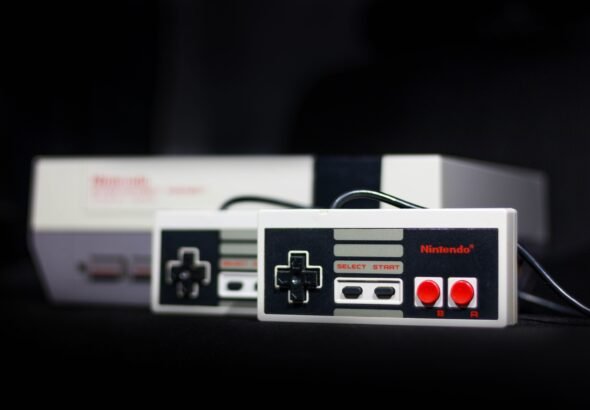 Classic Nintendo console and controller setup evoking GameCube and Wii era gaming