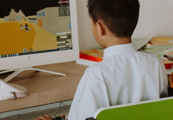 Student playing a browser game on a school computer during free time