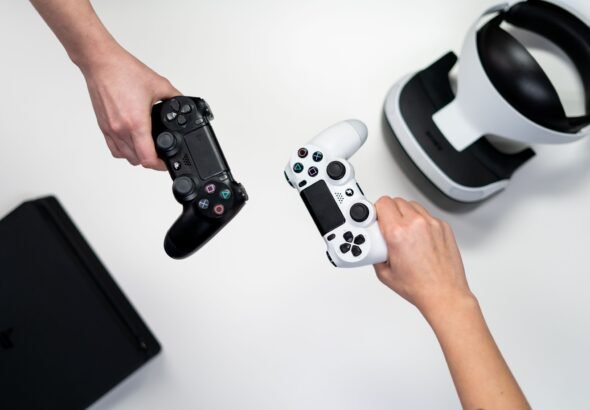 Game controller resting near a gaming console