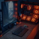 Modern gaming desk and chair setup with RGB lighting and dual monitors