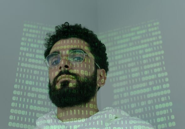 Person carefully checking a website on a laptop screen