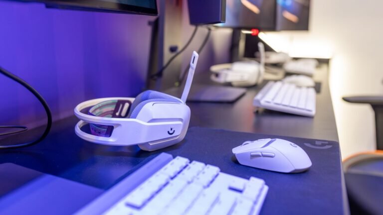 White gaming PC setup with white headset, keyboard and mouse