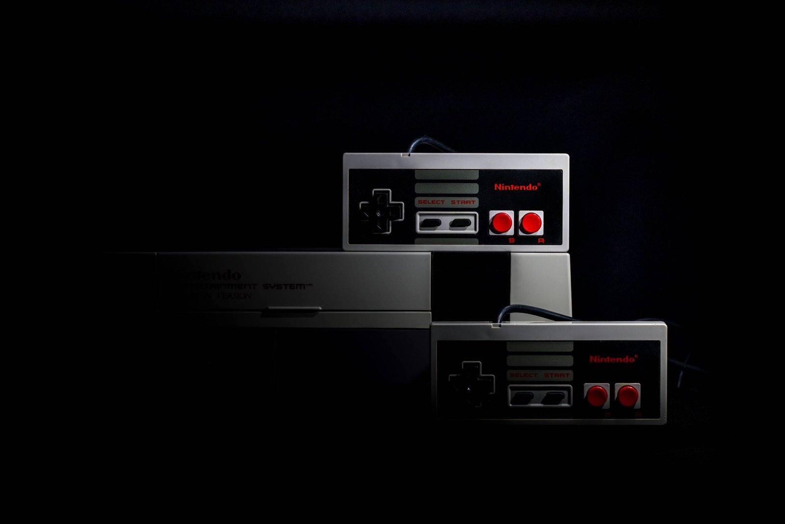Nintendo console and controller setup on a shelf
