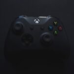 Xbox controller illuminated against a dark background