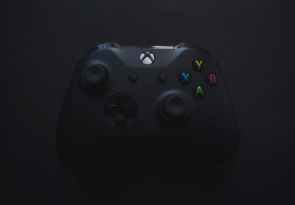 Xbox controller illuminated against a dark background